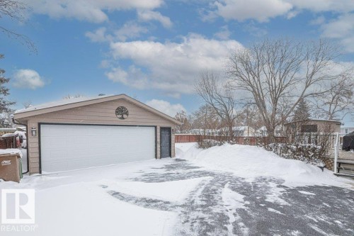 Snow covered garage with a detached garage - 1 Larkspur Crescent, St. Albert, AB - Outdoor