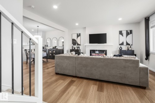 7012 54 Avenue, Beaumont, AB - Indoor Photo Showing Living Room With Fireplace