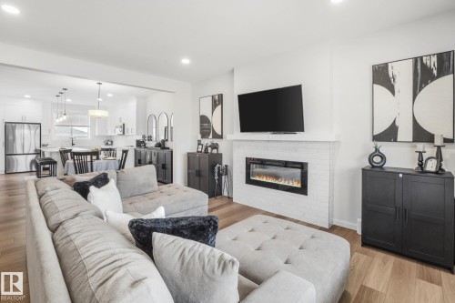 7012 54 Avenue, Beaumont, AB - Indoor Photo Showing Living Room With Fireplace