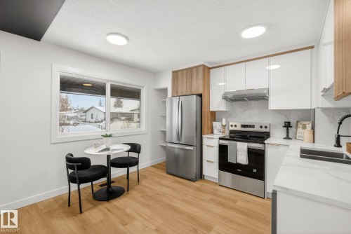 1 13833 30 Street, Edmonton, AB - Indoor Photo Showing Kitchen With Stainless Steel Kitchen With Double Sink