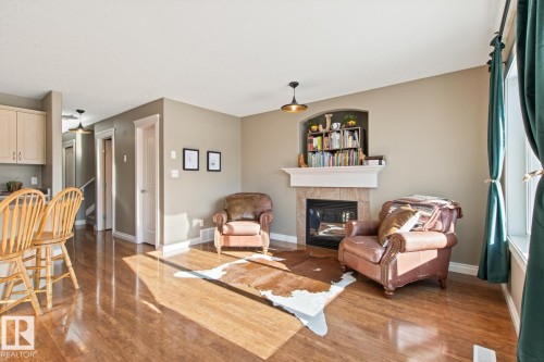 50 Meridian Loop, Stony Plain, AB - Indoor Photo Showing Living Room With Fireplace