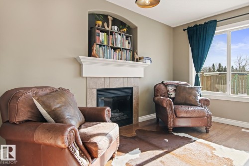 50 Meridian Loop, Stony Plain, AB - Indoor Photo Showing Living Room With Fireplace