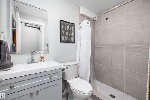 Bathroom featuring a stall shower and vanity - 11242 72 Avenue, Edmonton, AB - Indoor Photo Showing Bathroom