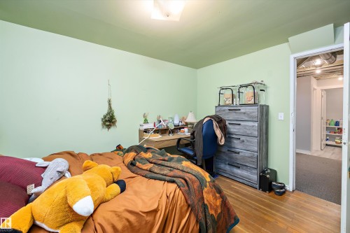 Bedroom with wood-type flooring - 11242 72 Avenue, Edmonton, AB - Indoor