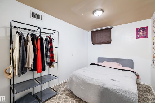 Carpeted bedroom featuring a closet - 11242 72 Avenue, Edmonton, AB - Indoor Photo Showing Bedroom