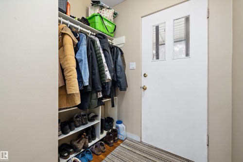 Mudroom with wood finished floors and baseboards - 11242 72 Avenue, Edmonton, AB - Indoor With Storage