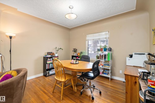 Office space featuring hardwood / wood-style floors and a textured ceiling - 11242 72 Avenue, Edmonton, AB - Indoor Photo Showing Dining Room