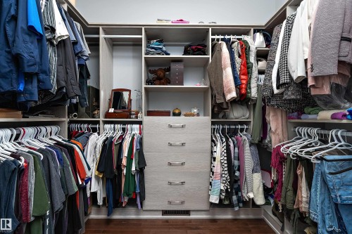 Walk in closet with dark wood finished floors - 1409 Westerra Bay, Stony Plain, AB - Indoor With Storage