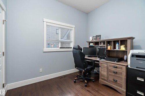 Home office with dark wood-style floors and baseboards - 1409 Westerra Bay, Stony Plain, AB - Indoor Photo Showing Office