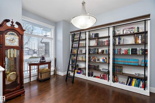 Living area with dark wood finished floors and baseboards - 1409 Westerra Bay, Stony Plain, AB - Indoor