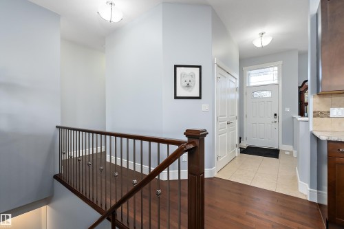 Entrance foyer featuring light wood-type flooring and baseboards - 1409 Westerra Bay, Stony Plain, AB - Indoor Photo Showing Other Room