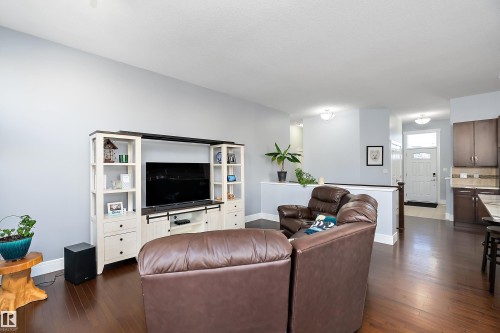 Living area with dark wood-style floors - 1409 Westerra Bay, Stony Plain, AB - Indoor Photo Showing Living Room