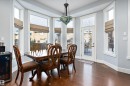 Dining room featuring wine cooler, plenty of natural light, and dark wood-type flooring - 1409 Westerra Bay, Stony Plain, AB  - Indoor Photo Showing Dining Room 