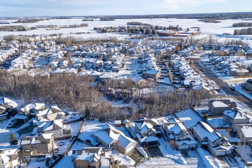 Snowy aerial view with a residential view - 1409 Westerra Bay, Stony Plain, AB - Outdoor With View