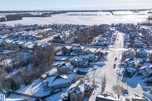 Snowy aerial view featuring a residential view - 1409 Westerra Bay, Stony Plain, AB - Outdoor With View