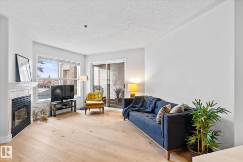 207 12028 103 Avenue, Edmonton, AB - Indoor Photo Showing Living Room With Fireplace