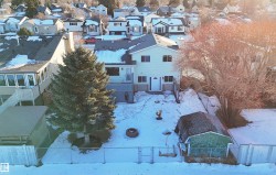 Snowy aerial view featuring a residential view - 