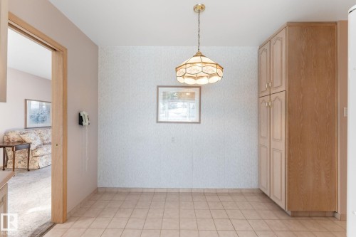 Unfurnished dining area with wallpapered walls - 3519 111B Street, Edmonton, AB - Indoor Photo Showing Other Room