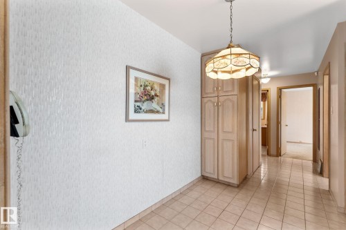 Hall featuring wallpapered walls and light tile patterned floors - 3519 111B Street, Edmonton, AB - Indoor Photo Showing Other Room