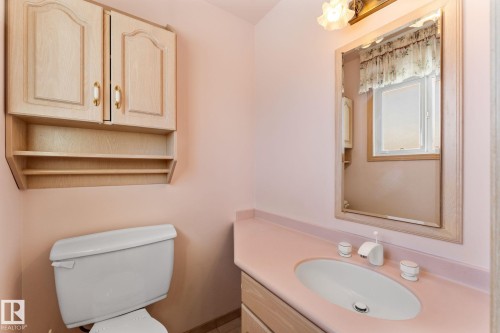 Half bathroom featuring vanity and toilet - 3519 111B Street, Edmonton, AB - Indoor Photo Showing Bathroom