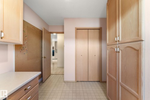 Kitchen with light wood finish cabinets, light countertops, and light flooring - 3519 111B Street, Edmonton, AB - Indoor