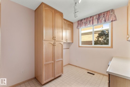 Laundry area with rail lighting and light flooring - 3519 111B Street, Edmonton, AB - Indoor Photo Showing Other Room