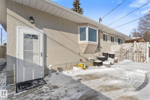 Snow covered house with stucco siding - 3519 111B Street, Edmonton, AB - Outdoor With Exterior