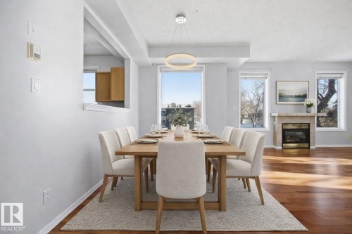 202 8108 109 Street, Edmonton, AB - Indoor Photo Showing Dining Room With Fireplace