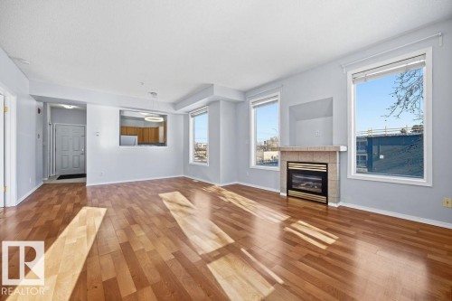 202 8108 109 Street, Edmonton, AB - Indoor Photo Showing Living Room With Fireplace