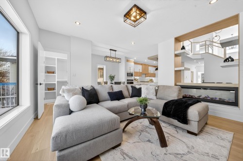 Living area with recessed lighting and light wood-style flooring - 9907 68 Street, Edmonton, AB - Indoor Photo Showing Living Room