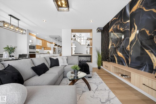 Living room with light wood-style flooring and recessed lighting - 9907 68 Street, Edmonton, AB - Indoor Photo Showing Living Room
