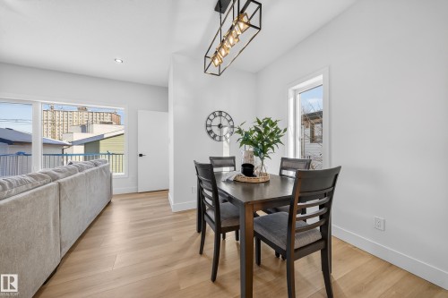 Dining space featuring light wood-type flooring and baseboards - 9907 68 Street, Edmonton, AB - Indoor Photo Showing Dining Room