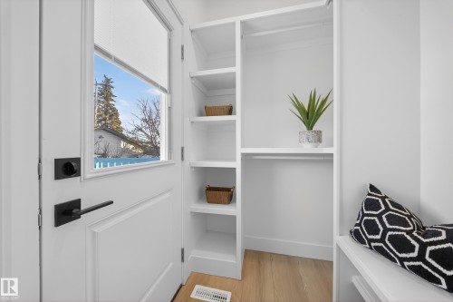 Walk in closet featuring light wood finished floors - 9907 68 Street, Edmonton, AB - Indoor