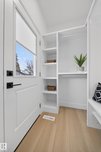 Walk in closet with light wood-style flooring - 9907 68 Street, Edmonton, AB - Indoor With Storage