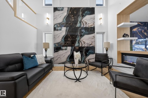 Lobby with a high ceiling - 9907 68 Street, Edmonton, AB - Indoor Photo Showing Living Room With Fireplace