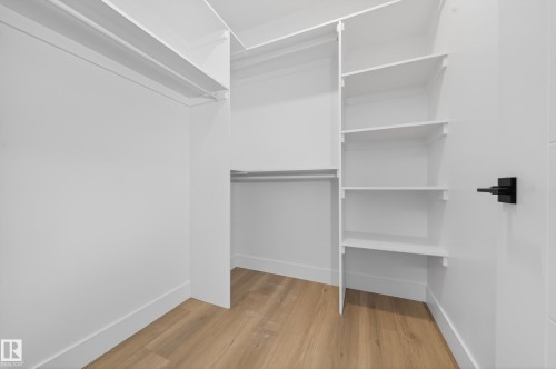 Walk in closet featuring light wood-style floors - 9907 68 Street, Edmonton, AB - Indoor With Storage