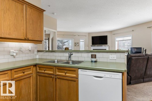 101 260 Sturgeon Road, St. Albert, AB - Indoor Photo Showing Kitchen With Double Sink