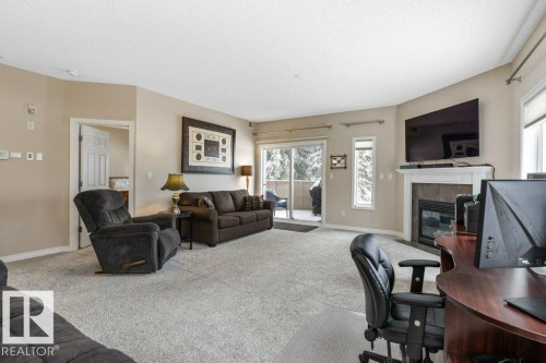101 260 Sturgeon Road, St. Albert, AB - Indoor Photo Showing Living Room With Fireplace