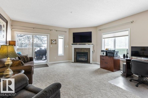 101 260 Sturgeon Road, St. Albert, AB - Indoor Photo Showing Living Room With Fireplace