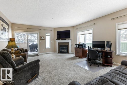 101 260 Sturgeon Road, St. Albert, AB - Indoor Photo Showing Living Room With Fireplace