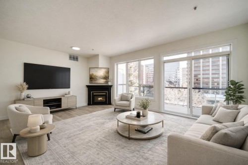 532 10023 110 Street, Edmonton, AB - Indoor Photo Showing Living Room With Fireplace