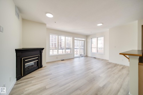 532 10023 110 Street, Edmonton, AB - Indoor Photo Showing Other Room With Fireplace