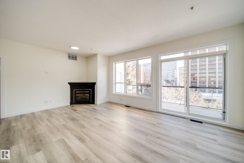 532 10023 110 Street, Edmonton, AB - Indoor Photo Showing Living Room With Fireplace