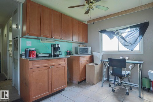 Office space with ceiling fan and light tile patterned floors - 19 Ridgeway Drive Nw, Edmonton, AB - Indoor
