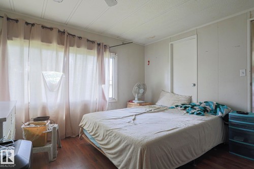 Bedroom featuring dark wood-style flooring - 19 Ridgeway Drive Nw, Edmonton, AB - Indoor Photo Showing Bedroom