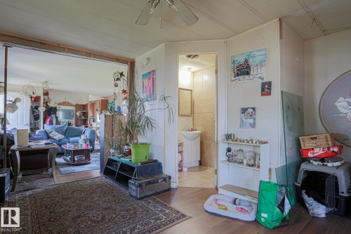 Bedroom featuring wood finished floors and a ceiling fan - 19 Ridgeway Drive Nw, Edmonton, AB - Indoor Photo Showing Other Room