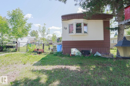 View of home's exterior with a gate - 19 Ridgeway Drive Nw, Edmonton, AB - Outdoor