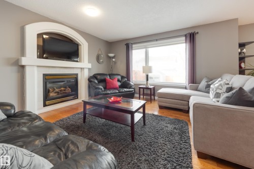 2844 40B Avenue, Edmonton, AB - Indoor Photo Showing Living Room With Fireplace