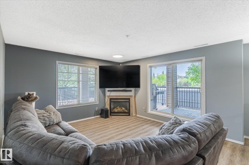 101 2098 Blackmud Creek Drive, Edmonton, AB - Indoor Photo Showing Living Room With Fireplace