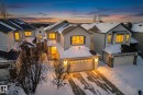 View of front facade featuring an attached garage, concrete driveway, and stone siding - 1734 63A Street, Edmonton, AB  - Outdoor 